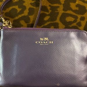 Adorable purple Coach wristlet great condition beautiful color purple 6” by 4”